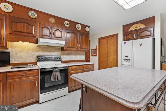 12810 Kending Ln, Clear Spring, MD 21722 - kitchen featuring white appliances, under cabinet range hood, decorative backsplash, light flooring, and a kitchen island