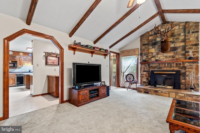 12810 Kending Ln, Clear Spring, MD 21722 - living area with light carpet, a stone fireplace, and a ceiling fan