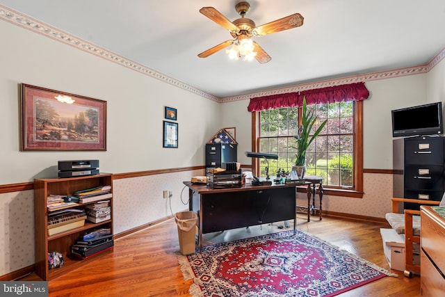 12810 Kending Ln, Clear Spring, MD 21722 - office with wallpapered walls, wood finished floors, a ceiling fan, and a wainscoted wall