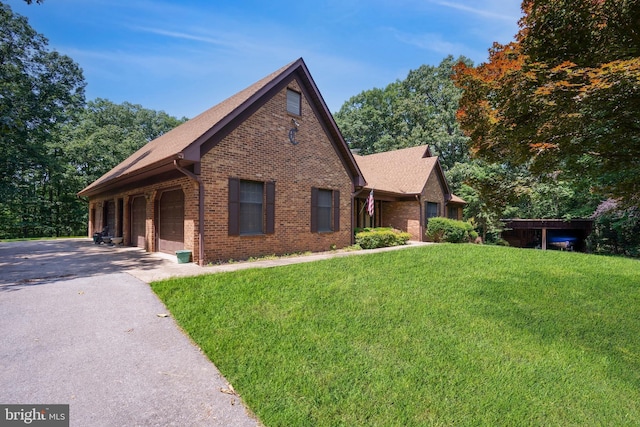 12810 Kending Ln, Clear Spring, MD 21722 - view of front of house featuring brick siding, asphalt driveway, and a front yard
