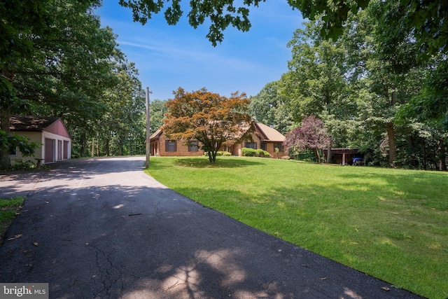 12810 Kending Ln, Clear Spring, MD 21722 - obstructed view of property with a front lawn, an outbuilding, and a garage