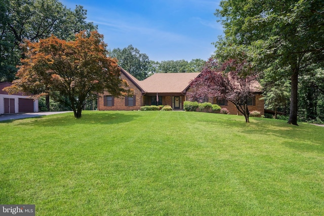 12810 Kending Ln, Clear Spring, MD 21722 - view of front of home with a front yard, a garage, and brick siding