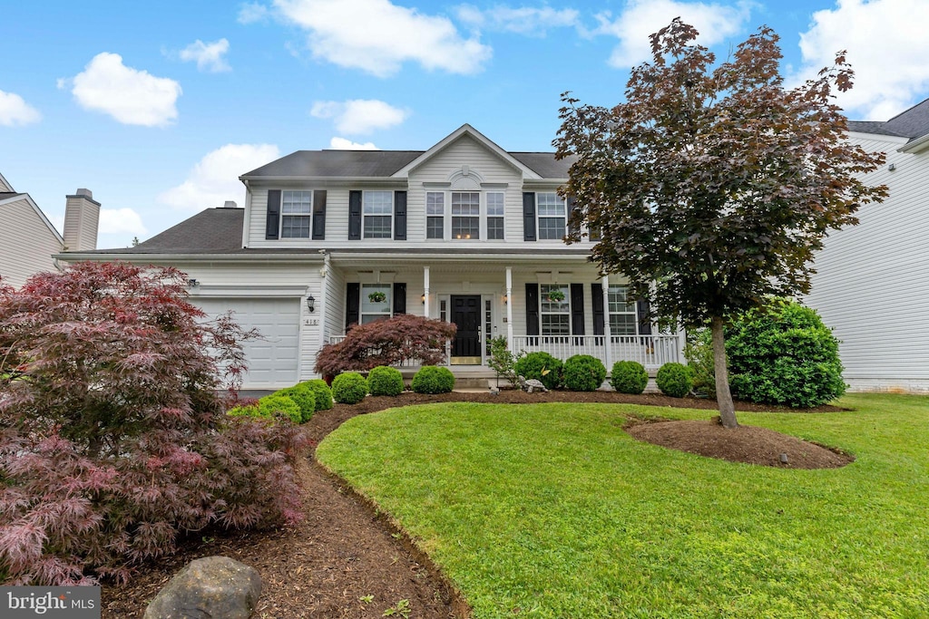 418 Hughs Rd, Charles Town, WV 25414 - colonial home featuring covered porch, an attached garage, and a front lawn