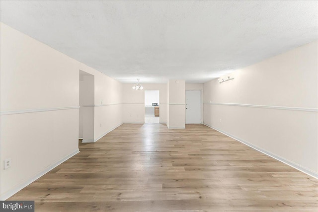 400 Glendale Rd Unit G-13, Havertown, PA 19083 - unfurnished room with a chandelier and light wood-type flooring