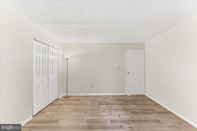 400 Glendale Rd Unit G-13, Havertown, PA 19083 - unfurnished bedroom featuring a textured ceiling, light wood-style floors, and a closet