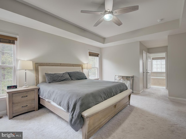 7436 Pensacola Pl, Gainesville, VA 20155 - bedroom featuring light carpet, multiple windows, a raised ceiling, and ceiling fan