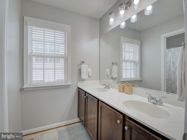 7436 Pensacola Pl, Gainesville, VA 20155 - bathroom featuring double vanity and tile patterned flooring