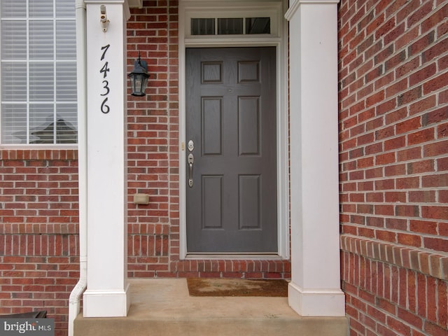 7436 Pensacola Pl, Gainesville, VA 20155 - entrance to property featuring brick siding and a porch