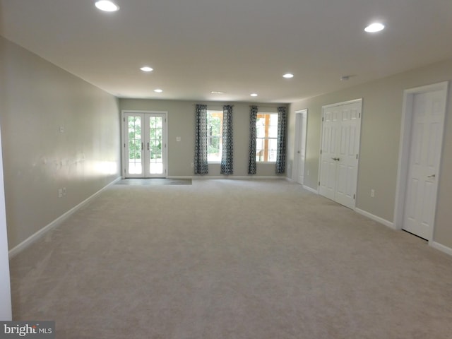 7436 Pensacola Pl, Gainesville, VA 20155 - unfurnished living room with recessed lighting, light carpet, and french doors