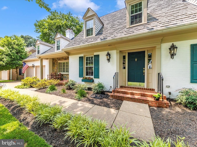 213 Midsummer Cir, Gaithersburg, MD 20878 - doorway to property featuring a high end roof, an attached garage, a chimney, and covered porch