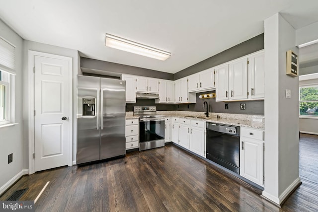 9946 Canvasback Way, Damascus, MD 20872 - kitchen featuring appliances with stainless steel finishes, dark wood finished floors, white cabinets, and light stone countertops