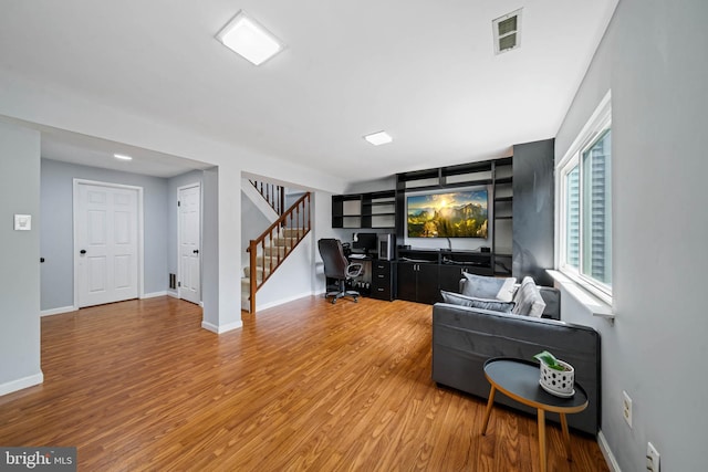 9946 Canvasback Way, Damascus, MD 20872 - living area featuring wood finished floors, an office area, and stairway