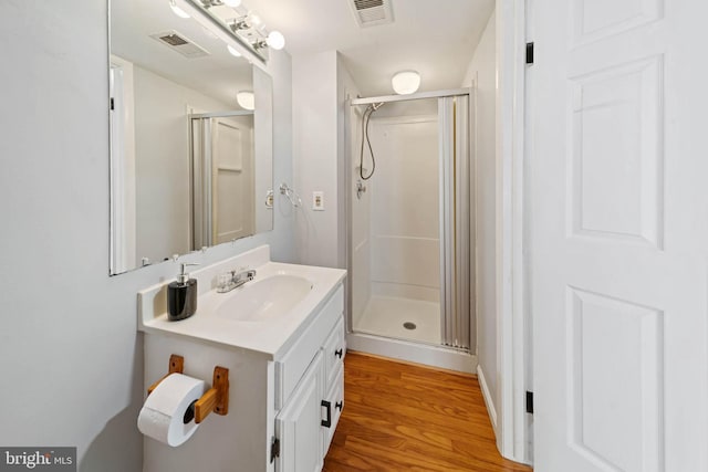 9946 Canvasback Way, Damascus, MD 20872 - full bath featuring a stall shower, vanity, and wood finished floors