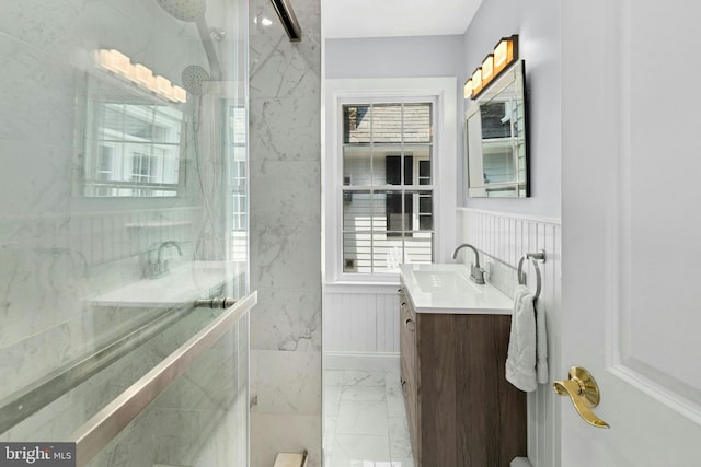 282 Crabapple Ln, East Stroudsburg, PA 18302 - bathroom featuring marble finish floors, vanity, a marble finish shower, and wainscoting