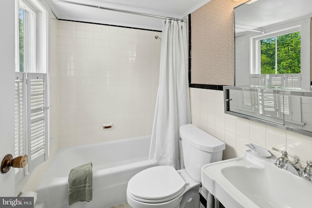 282 Crabapple Ln, East Stroudsburg, PA 18302 - full bathroom with wallpapered walls, plenty of natural light, tile walls, and shower / bathtub combination with curtain