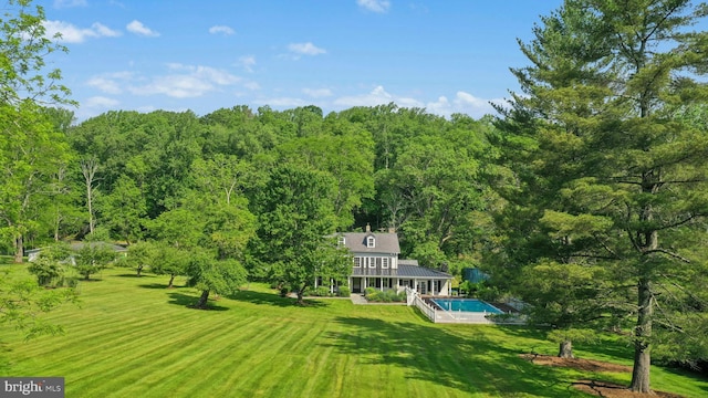 282 Crabapple Ln, East Stroudsburg, PA 18302 - view of green lawn featuring an outdoor pool and a wooded view