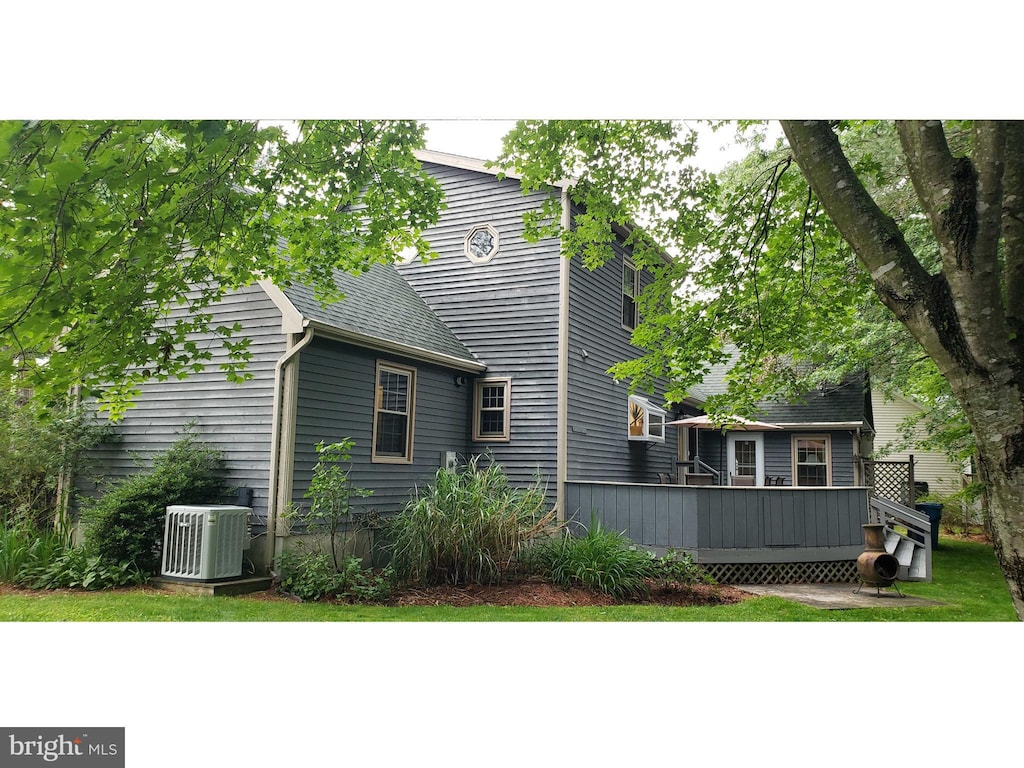 6 Quincy Ct, Ocean Pines, MD 21811 - back of property with a wooden deck and a shingled roof