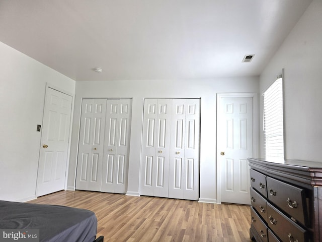 6529 Huntshire Dr, Elkridge, MD 21075 - bedroom featuring multiple closets and light wood finished floors