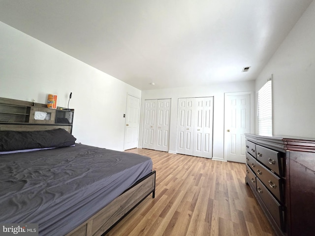 6529 Huntshire Dr, Elkridge, MD 21075 - bedroom featuring light wood finished floors and multiple closets