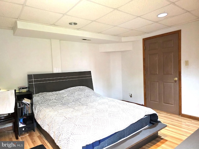 6529 Huntshire Dr, Elkridge, MD 21075 - bedroom featuring a drop ceiling and light wood-style floors