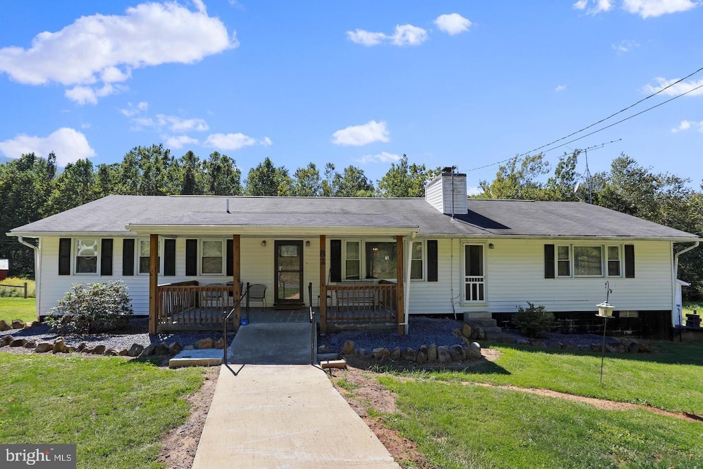 82 Broad Run Rd, Bentonville, VA 22610 - ranch-style home with covered porch, a front lawn, and a chimney