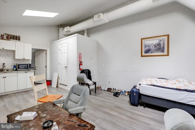 301 Broad St, Beverly, NJ 08010 - dining area featuring lofted ceiling and light wood-style flooring