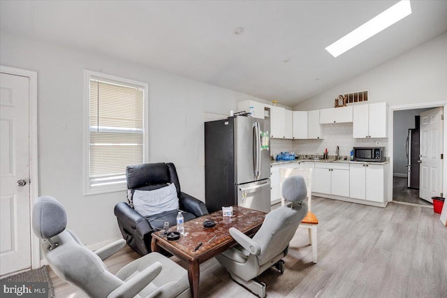 301 Broad St, Beverly, NJ 08010 - home office with vaulted ceiling and light wood-style floors