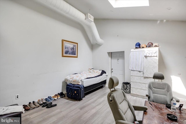 301 Broad St, Beverly, NJ 08010 - bedroom with wood finished floors and a skylight