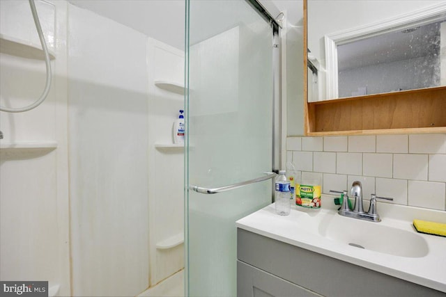 301 Broad St, Beverly, NJ 08010 - full bathroom with a stall shower, backsplash, and vanity