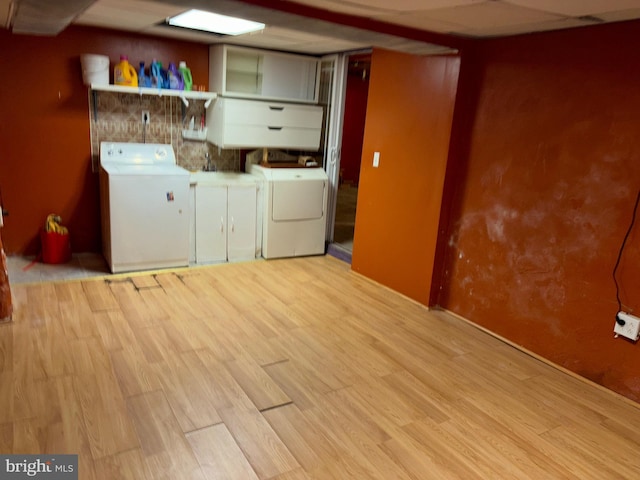 5122 Stenton Ave, Philadelphia, PA 19144 - laundry room with washing machine and clothes dryer, cabinet space, and light wood finished floors