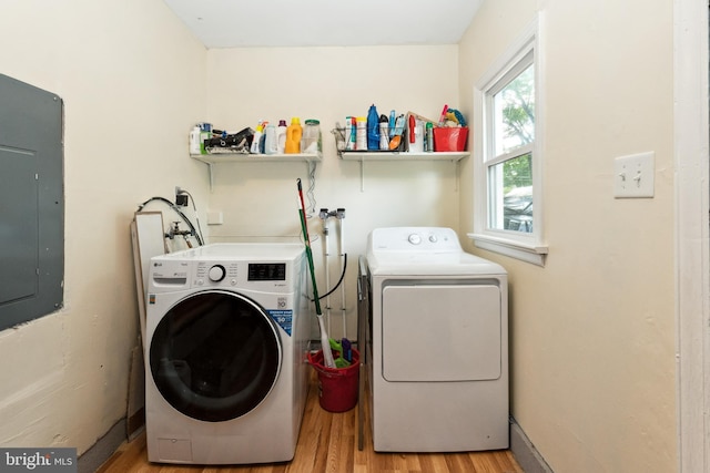 104 N Beech Ave, Highland Springs, VA 23075 - laundry area featuring separate washer and dryer, light wood-style floors, and electric panel