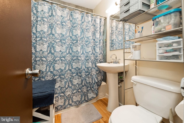 104 N Beech Ave, Highland Springs, VA 23075 - full bathroom with wood finished floors and a shower with curtain