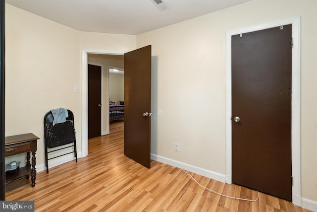 104 N Beech Ave, Highland Springs, VA 23075 - bedroom with light wood-type flooring and baseboards