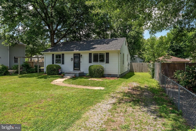 104 N Beech Ave, Highland Springs, VA 23075 - view of front facade with crawl space, a fenced backyard, roof with shingles, and driveway