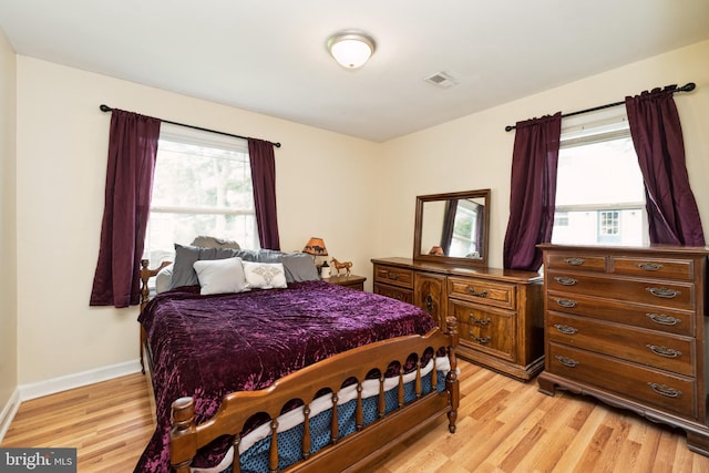 104 N Beech Ave, Highland Springs, VA 23075 - bedroom with light wood-type flooring and baseboards