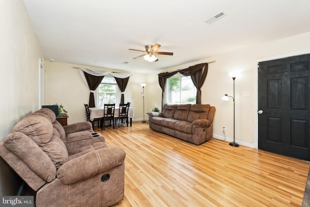 104 N Beech Ave, Highland Springs, VA 23075 - living area with a ceiling fan, healthy amount of natural light, and light wood finished floors