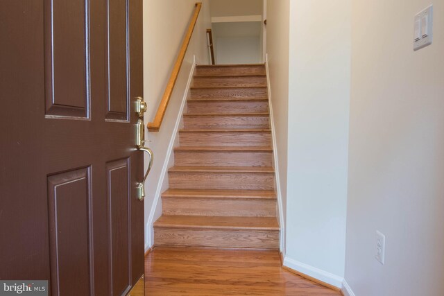 114 Herndon Mill Cir, Herndon, VA 20170 - stairway with wood finished floors and baseboards