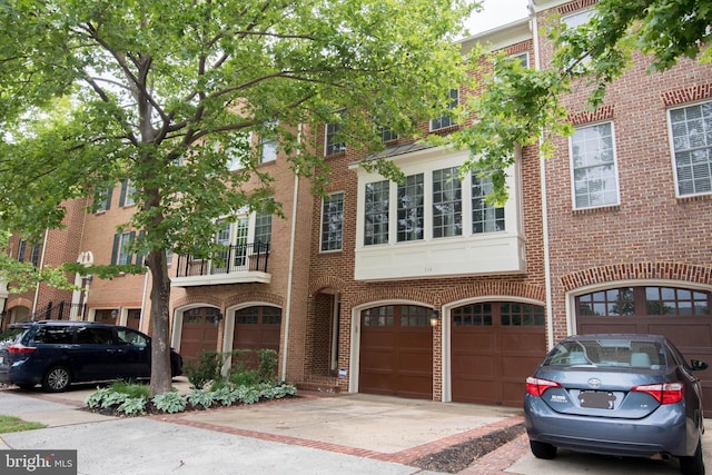 114 Herndon Mill Cir, Herndon, VA 20170 - townhome / multi-family property with an attached garage, driveway, and brick siding
