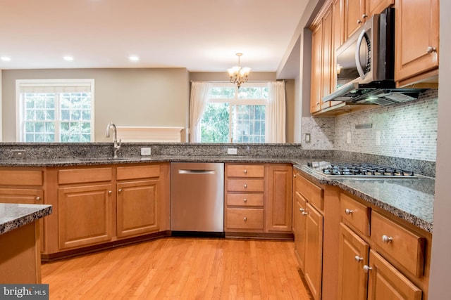 114 Herndon Mill Cir, Herndon, VA 20170 - kitchen with stainless steel appliances, light wood-type flooring, a chandelier, healthy amount of natural light, and recessed lighting