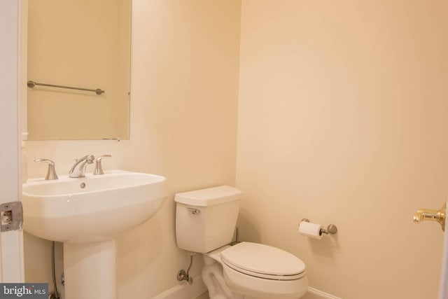 114 Herndon Mill Cir, Herndon, VA 20170 - half bathroom with baseboards and toilet
