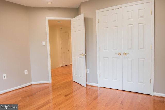 114 Herndon Mill Cir, Herndon, VA 20170 - unfurnished bedroom featuring light wood-type flooring and a closet