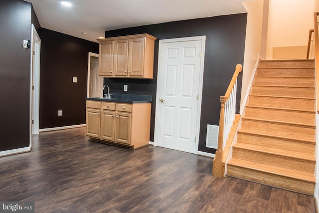 114 Herndon Mill Cir, Herndon, VA 20170 - kitchen with dark wood-style flooring, dark countertops, light brown cabinetry, and recessed lighting