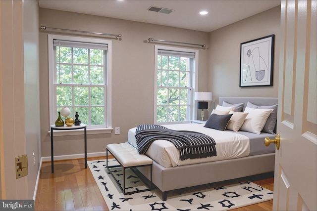114 Herndon Mill Cir, Herndon, VA 20170 - bedroom featuring wood finished floors, multiple windows, and recessed lighting