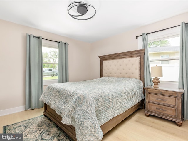 13222 Parson Ln, Fairfax, VA 22033 - bedroom featuring light wood-style floors and multiple windows