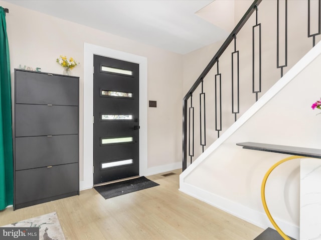 13222 Parson Ln, Fairfax, VA 22033 - entryway with stairway and light wood-style floors