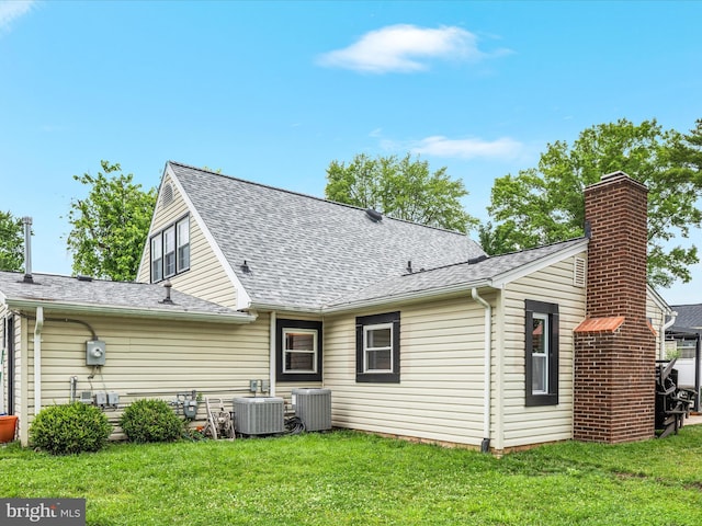 13222 Parson Ln, Fairfax, VA 22033 - rear view of property featuring a yard, a shingled roof, and a chimney