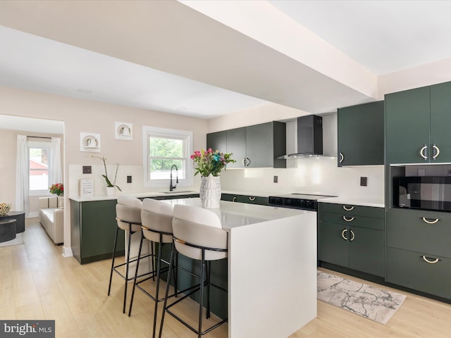 13222 Parson Ln, Fairfax, VA 22033 - kitchen with wall chimney range hood, light countertops, light wood-type flooring, and a breakfast bar area