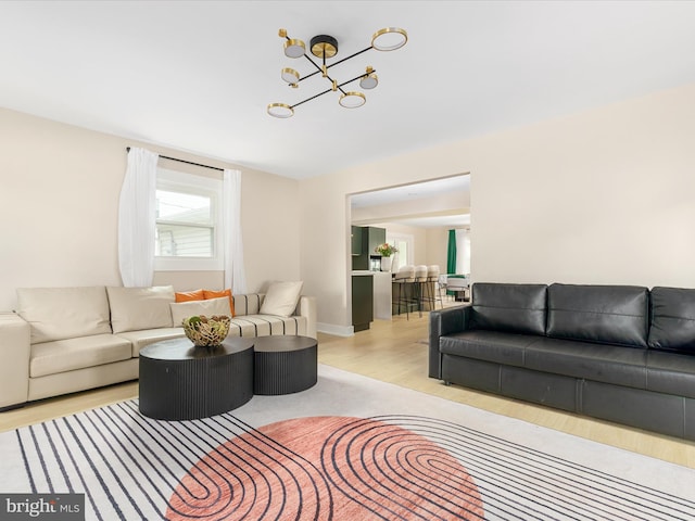 13222 Parson Ln, Fairfax, VA 22033 - living room featuring light wood finished floors and a chandelier