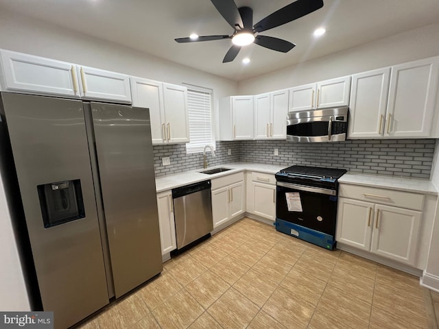 6610 N Smedley St, Philadelphia, PA 19126 - kitchen with appliances with stainless steel finishes, white cabinetry, tasteful backsplash, a ceiling fan, and recessed lighting