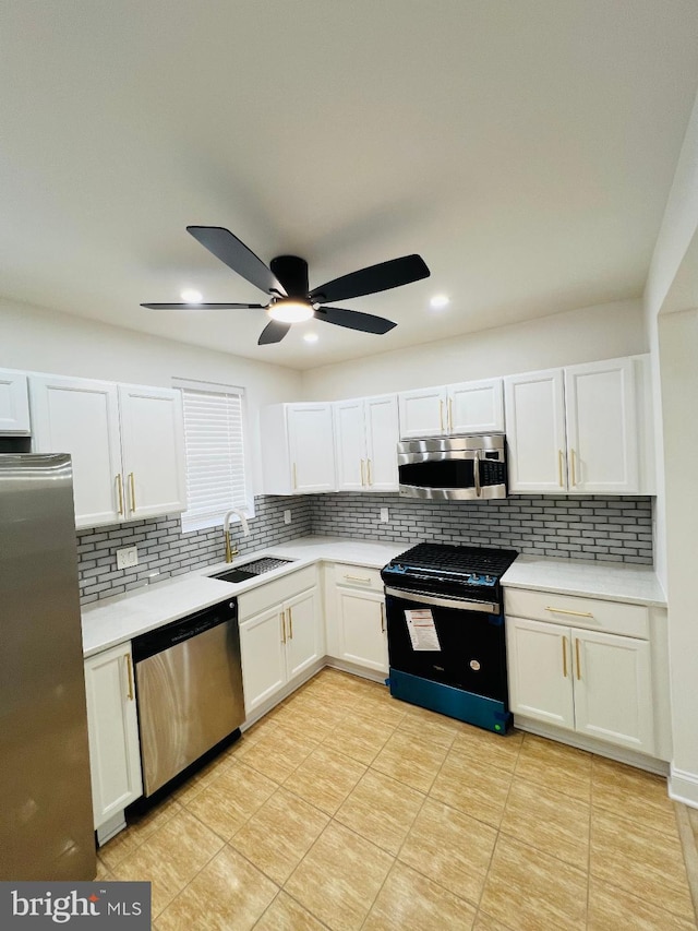 6610 N Smedley St, Philadelphia, PA 19126 - kitchen with stainless steel appliances, backsplash, white cabinetry, and recessed lighting